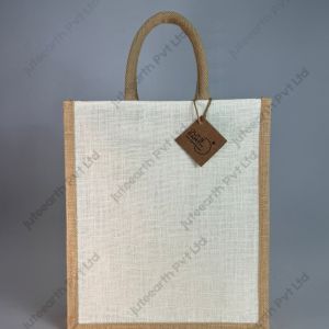 Plain half-white jute bag with jute-colour rope handles, narrow shape, front view