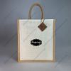 Custom printed half-white jute bag with jute-colour rope handles, narrow shape, front view with sample logo