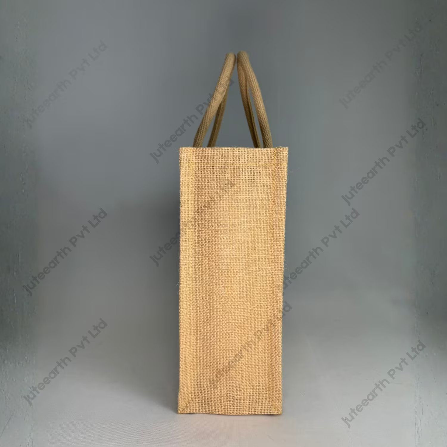 Custom printed half-white jute bag with jute-colour rope handles, narrow shape, side view showing the gusset