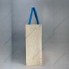 Custom printed JuCo (jute cotton) bag with blue V-strip print and blue rope handles, side view showing the gusset