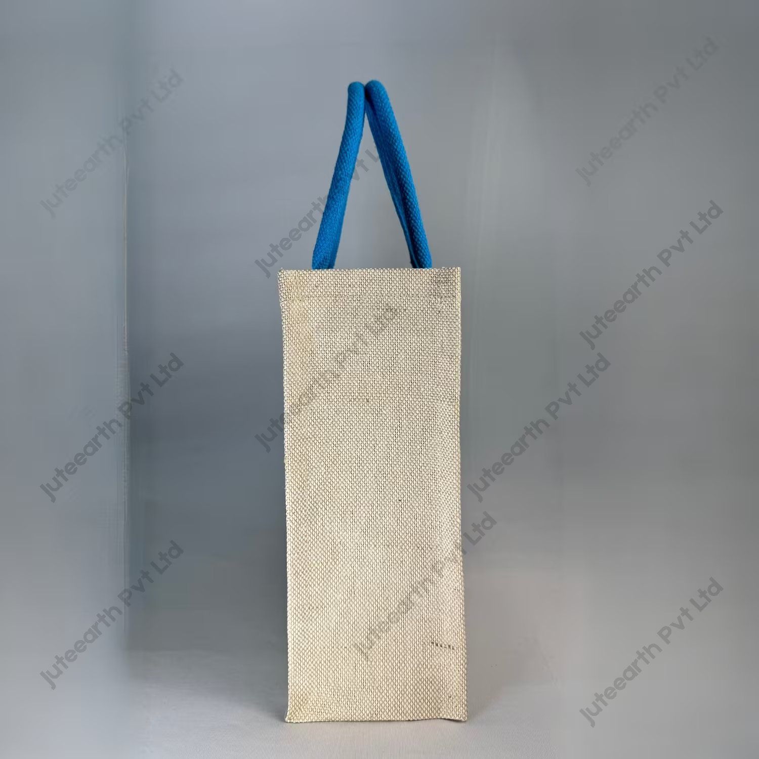 Custom printed JuCo (jute cotton) bag with blue V-strip print and blue rope handles, side view showing the gusset