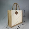 Plain half-white jute bag with jute-colour rope handles, landscape shape, angled view with dimensions 12 x 14 x 5 inches