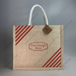 Custom printed JuCo (jute cotton) bag with red minimum-line stripe print and white rope handles, front view with sample logo