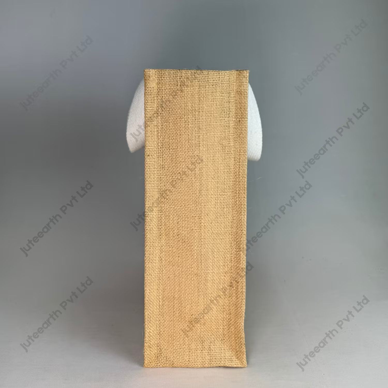 Custom printed natural jute bag with starch finish and white cotton handles, narrow shape, side view showing the gusset