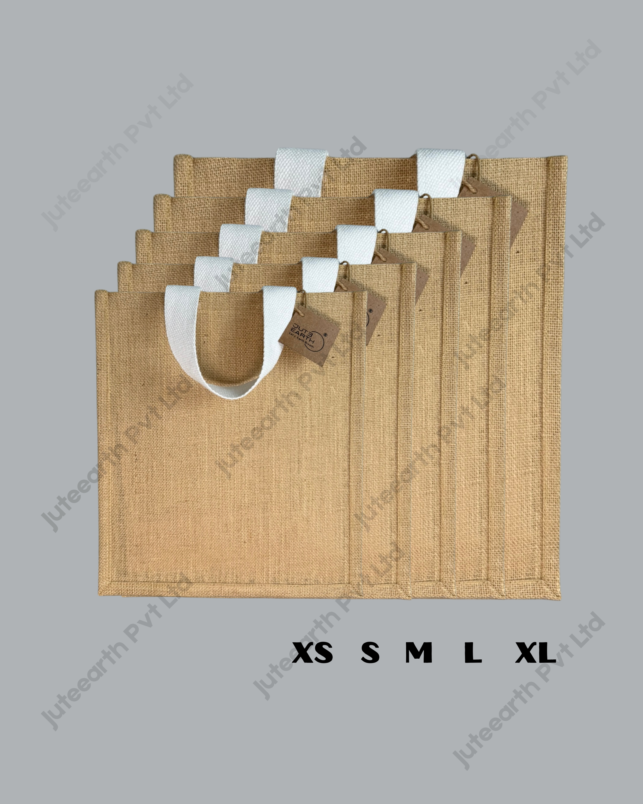 Plain natural jute bag with starch finish and white cotton handles, narrow shape, sizes XS to XL stacked to show scale